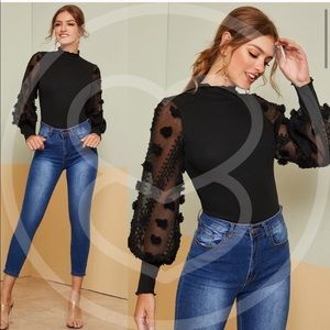 Black turtleneck with design